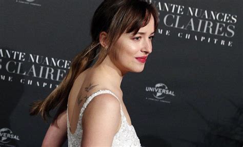 Los misteriosos tatuajes de Dakota Johnson:。